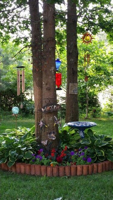 Home designing blog magazine covering architecture, cool products! Flower bed around tree cluster... works well in small ...
