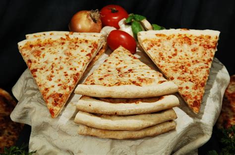 Prices and availability are subject to change without notice. 18" Cheese Pizza Slices - Kasa Foods