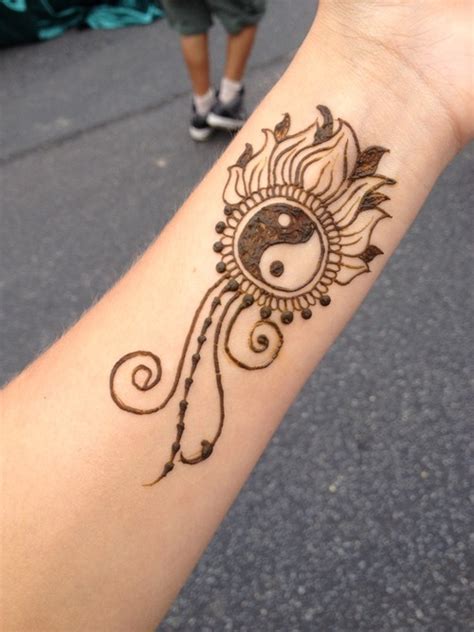 Woman with beautiful henna tattoos on hands, closeup. 25 Henna Tattoo Design and Placement Ideas - The Xerxes