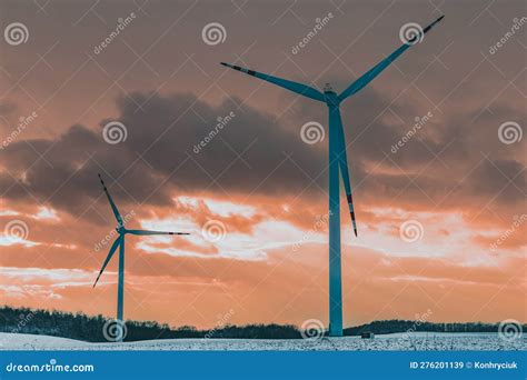 Windmills In A Snowy Field At Sunset Stock Image Image Of Environment