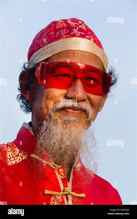 Portrait Old Chinese Man With Red Glasses Hat And Beard Chinese New