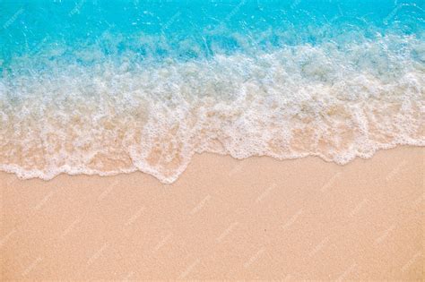 Premium Photo Soft Wave On Sandy Beach Background