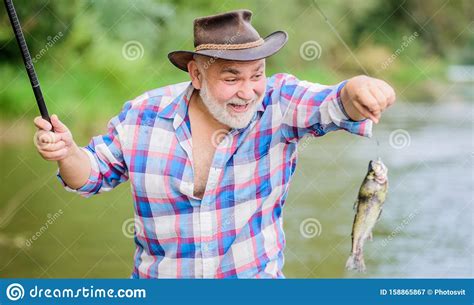 Slightly Older Pothunter Man Catching Fish Retired Bearded Fisher