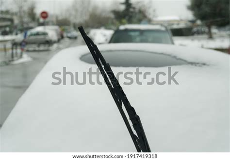 Lifted Screen Wiper Before A Car Covered With Snow Day View Of Frozen
