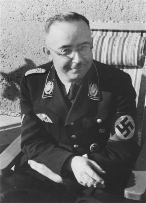 A family photo of heinrich himmler in valepp, bavaria in 1935. Portrait of Reichsfuehrer-SS Heinrich Himmler seated on a ...
