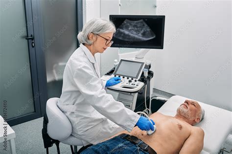 Ultrasound Specialist Doing Ultrasonography Of Abdominal Cavity For