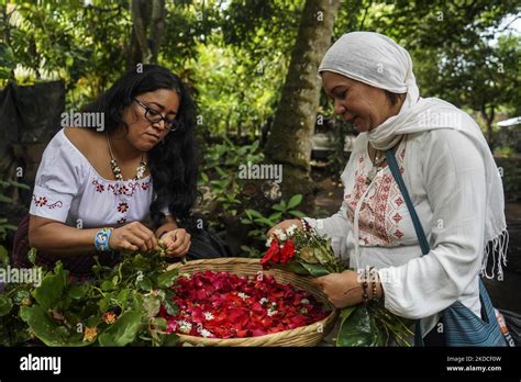 Pipil Indigenous Community Women Prepare Flowers For An Altar During A