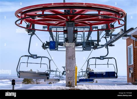 Wheel Mountain Ski Lift With Chairs On Top Of The Mountain Stock Photo