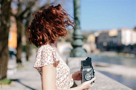 Beautiful Woman Holding A Vintage Camera By Stocksy Contributor Vero