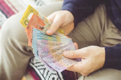 Image Of Hands Holding Australian Currency Austockphoto