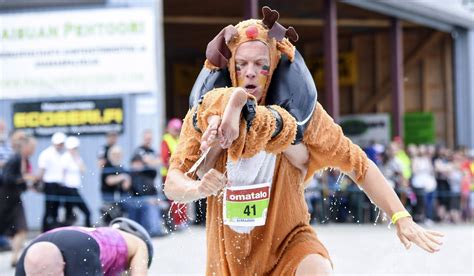 Wife Carrying Is A Thing In Finland This Man And Woman Are World