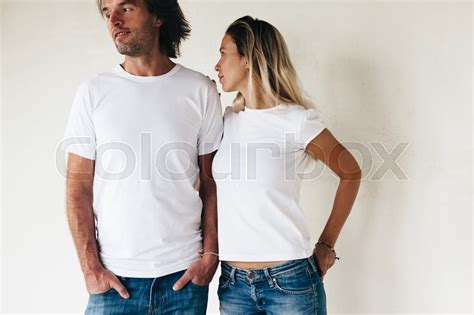 Download Two models man and woman wearing blanc t-shirt posing ...