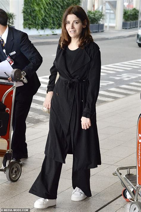 Nigella Lawson Cuts A Casual Figure In A Trench Coat And Sneakers As