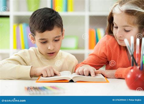 Young Brother And Sister Learn How To Read At Home Stock Photo Image