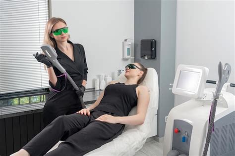 Premium Photo Young Woman Receiving Laser Treatment In Cosmetology Clinic