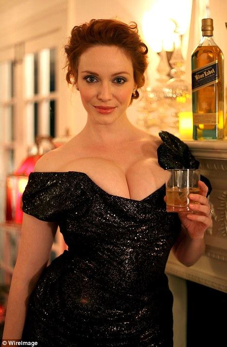 Christina Hendricks Cheesily Promotes Whiskey At A Christmas Holiday Party Daily Mail Online