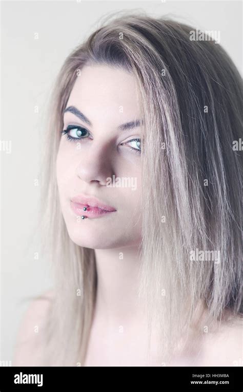 Beautiful Blond Girl With Lip Piercing Studio Portrait Stock Photo Alamy