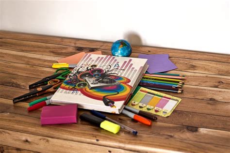 Notebook Surrounded By School Supplies On A Wooden Surface Stock Image