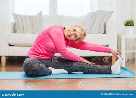 Happy Woman Stretching Leg On Mat At Home Stock Image Image Of
