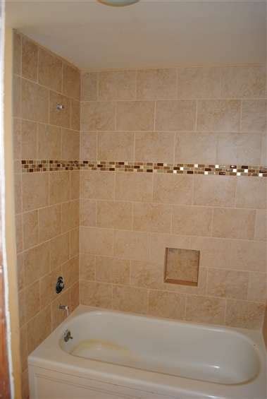 I reckon that's because of those bloomin gorgeous bathroom tiles. mosaic strip in the tub shower wall tile | Bathroom ...