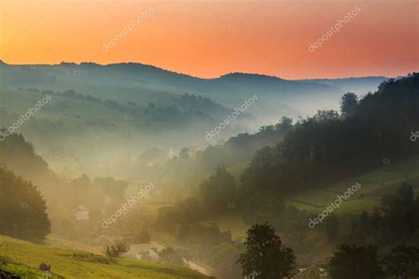 Early Morning Fog In Mountains — Stock Photo © Pellinni 27779241