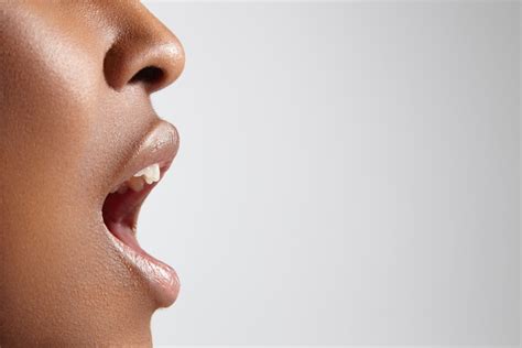 Shutterstock208773370 Profile Of A Black Woman With Open Mouth Image