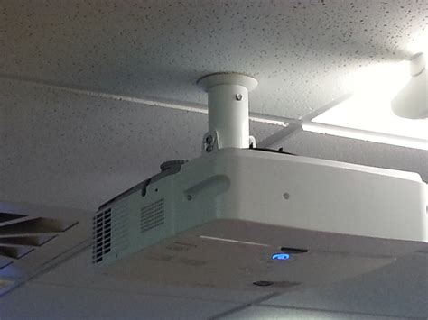 The next step is to mount the projector to the ceiling. Bespoke Corporate HD Projector & Screen Installation ...