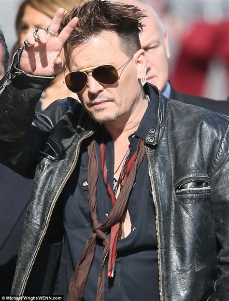 Johnny Depp Puffs Away On A Cigarillo Ahead Of Jimmy Kimmel Live Interview Daily Mail Online