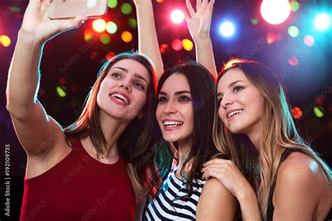Smiling Girls Taking Selfie In A Night Club Stock Foto Adobe Stock