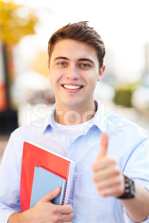 Male Student Showing Thumbs Up Stock Photo Royalty Free Freeimages