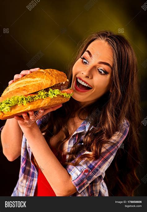 Woman Eating Hamburger Student Consume Fast Food Girl Bite Of Very