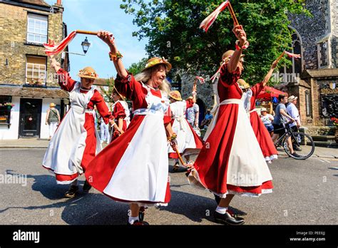 Traditional English Folk Dancers Women Of The Rising Larks Morris Team Dancing In The Street At