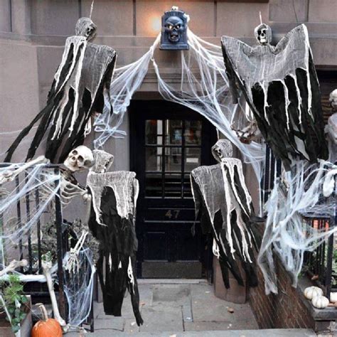 You can hang a scary grim reaper decoration or a floating ghost from a tree to create a spooky look outside. Halloween Skull Hanging Ghost Haunted House Grim Reaper ...