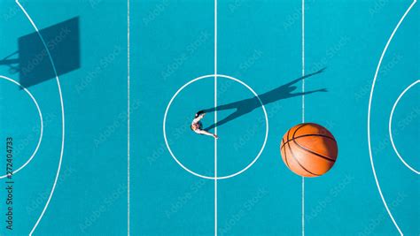 Basketball Player Long Shadows On Basketball Court Creative Visual