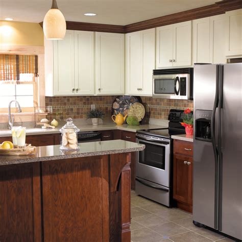 Black and white kitchen cabinets. StarMark Cabinetry Two-Tone Kitchen in Maple and Oak ...