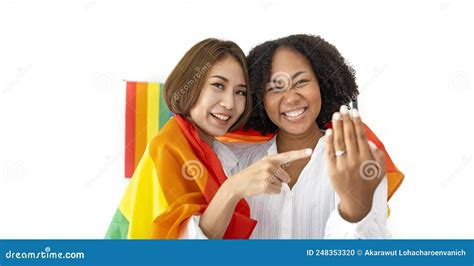 Couple Of Same Sex Marriage From Difference Races Showing Their Wedding Ring With Lgbtq Rainbow