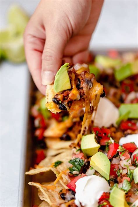 Easy Nachos Layered With Seasoned Beef And Black Beans Melty Cheese