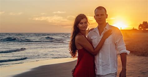 Woman Standing Beside Man Near Shoreline · Free Stock Photo