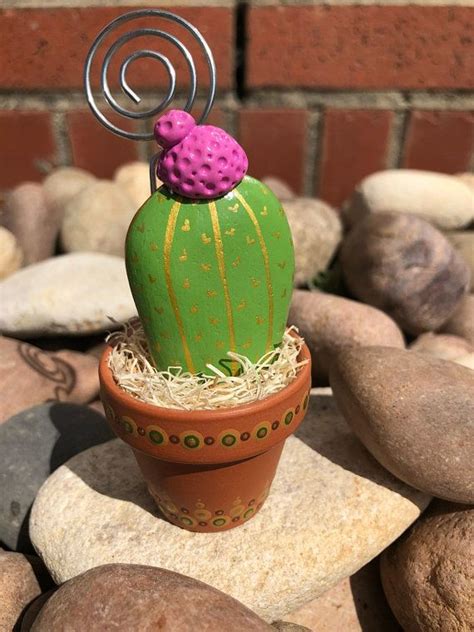 I place my cactus not close to my doors more on the outside by my opening gate to deter negative neighbors.also for jujak use mini cannons for those ass.s at work they work pointed at the negative people because pointing a mini mirror would be to obvious where as the cannons are decorative but. Small Rock Cactus with Spiral Photo Holder | Painted rock ...