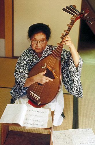 Woman Playing A Biwa Traditional Japanese Musical Instrument This