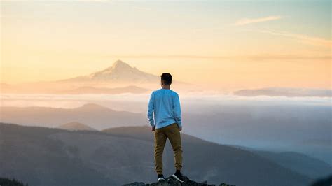 Man Is Standing On Top Of Mountain Alone Hd Wallpaper Peakpx