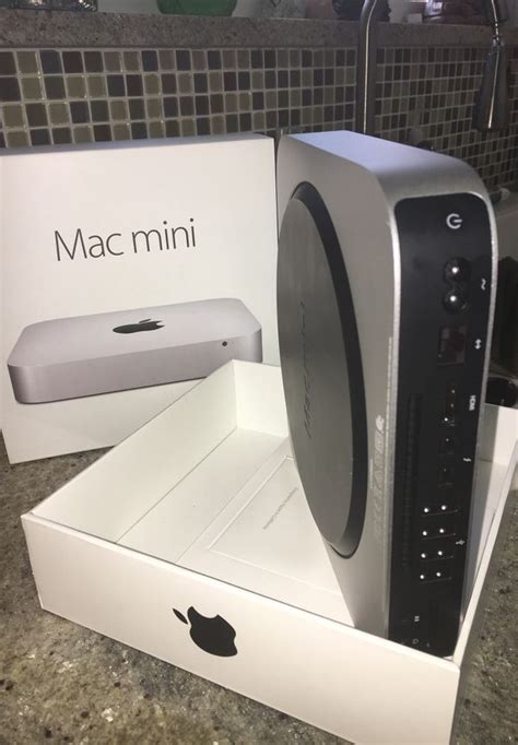Mac Mini With 25 Inch Led Display Monitor As Well As And Mouse Are