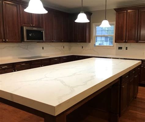 Granite kitchen countertops with dark cabinets. Calcatta Verona Quartz: A Quartz Countertop that Looks like Marble in 2020 | Brown kitchens ...