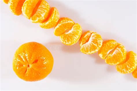 Whole Tangerine And Row Of Tangerine Slices Slices Of Citrus Fruits