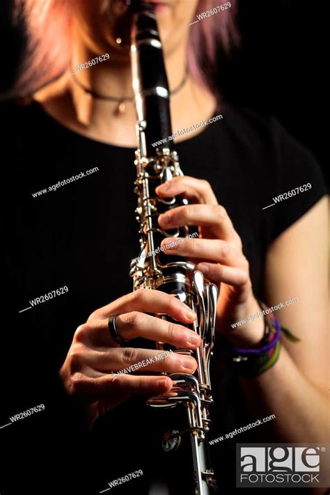 Woman Playing A Clarinet In Music School Stock Photo Picture And