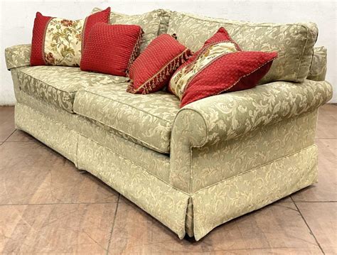 Lot Transitional Style Rolled Arm Skirted Sofa