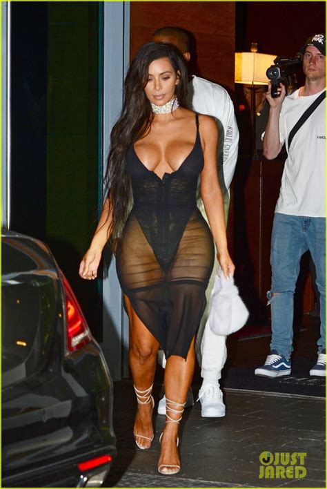 kim kardashian shows off major cleavage in sexy sheer dress for kanye west s miami concert