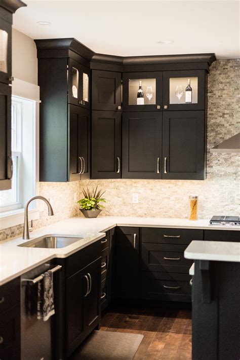 White quartz countertops are somewhat in balance with gray rustic cabinets and wood floors. Parade of Home detailed with Keeler cabinet hardware - Keeler Products