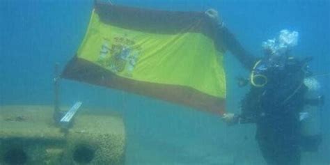 Spanish Divers Hold Flags As They Inspect Gibraltar Reef Blocks