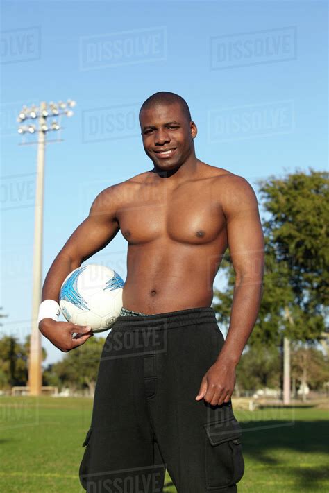 Black Man Holding Soccer Ball Stock Photo Dissolve